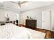 This bedroom features hardwood floors, a ceiling fan, and neutral walls that are perfect for relaxation and restful sleep at 980 Fenimore Cir, Sandy Springs, GA 30350