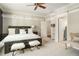 Bright bedroom with crown molding, neutral colors, and comfortable furnishings at 980 Fenimore Cir, Sandy Springs, GA 30350