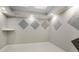 Neutral bonus room with sound-dampening wall treatments, recessed lighting, and tray ceiling at 980 Fenimore Cir, Sandy Springs, GA 30350