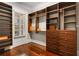 Large walk-in closet with custom wood shelving and drawers, plus a window at 980 Fenimore Cir, Sandy Springs, GA 30350