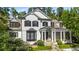 Attractive two-story home with a stylish black bay window, black trim, and manicured landscaping at 980 Fenimore Cir, Sandy Springs, GA 30350