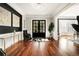 Grand foyer featuring gleaming hardwood floors, sophisticated decor, and a view to other rooms at 980 Fenimore Cir, Sandy Springs, GA 30350