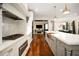 Gourmet kitchen featuring custom cabinets, marble countertops, stainless steel appliances, and brass hardware at 980 Fenimore Cir, Sandy Springs, GA 30350