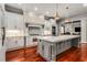 Spacious kitchen with marble island, stainless steel appliances, and custom white cabinetry at 980 Fenimore Cir, Sandy Springs, GA 30350