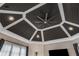 The living room with decorative ceiling, modern fan, and recessed lighting at 980 Fenimore Cir, Sandy Springs, GA 30350