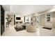 Finished basement living room with stylish decor, including fireplace and bar area at 980 Fenimore Cir, Sandy Springs, GA 30350