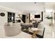 Finished basement living room with stylish decor, including fireplace and bar area at 980 Fenimore Cir, Sandy Springs, GA 30350