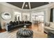 Open-concept living room featuring modern decor and seamless flow to the kitchen at 980 Fenimore Cir, Sandy Springs, GA 30350