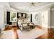 Elegant bedroom featuring hardwood floors, with large windows for natural light and stylish furnishings at 980 Fenimore Cir, Sandy Springs, GA 30350