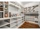 Custom pantry featuring wine storage, shelving and wooden floor at 980 Fenimore Cir, Sandy Springs, GA 30350