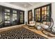 Covered patio with comfortable seating, egg chairs, and stylish decor at 980 Fenimore Cir, Sandy Springs, GA 30350
