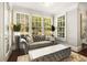 Bright sunroom featuring large windows and a comfortable sofa, perfect for relaxing and enjoying the view at 980 Fenimore Cir, Sandy Springs, GA 30350