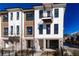 Stylish townhome features modern design, brick accents, a balcony, and well-maintained landscaping at 332 Olmstead Way # 38, Alpharetta, GA 30022
