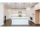 Bright kitchen with white cabinets, island, and stainless steel appliances at 332 Olmstead Way # 38, Alpharetta, GA 30022