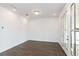 Open-concept living space with hardwood floors and natural light at 332 Olmstead Way # 38, Alpharetta, GA 30022