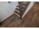 Close-up of the staircase with hardwood flooring and a modern railing at 332 Olmstead Way # 38, Alpharetta, GA 30022