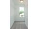 Walk-in closet with carpeted floor, metal shelving, and natural light at 332 Olmstead Way # 38, Alpharetta, GA 30022