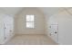 Attic with carpeted floor, white walls, and shelving and doors for storage at 2423 Rosapenna Nw Ln, Kennesaw, GA 30152