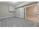 Basement room with gray plank flooring, recessed lighting, with doorway leading to other rooms in the home at 2423 Rosapenna Nw Ln, Kennesaw, GA 30152