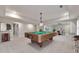 Finished basement featuring a pool table, bar area, and open space for entertainment at 2423 Rosapenna Nw Ln, Kennesaw, GA 30152