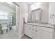 Bathroom features granite countertop vanity with storage, tiled floors, and a shower-tub combination for ultimate comfort and convenience at 2423 Rosapenna Nw Ln, Kennesaw, GA 30152