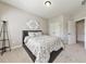 Spacious bedroom features a comfortable bed and neutral tones, creating a serene and inviting space perfect for relaxation at 2423 Rosapenna Nw Ln, Kennesaw, GA 30152