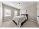 Bright bedroom with shutters and neutral tones features a comfortable bed and ample space, ideal for relaxation and personalization at 2423 Rosapenna Nw Ln, Kennesaw, GA 30152