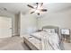 Bright bedroom features a comfortable bed with soft blankets and two bedside tables, complemented by natural light from the windows at 2423 Rosapenna Nw Ln, Kennesaw, GA 30152