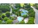Aerial shot of a refreshing community pool, tennis courts, and clubhouse at 2423 Rosapenna Nw Ln, Kennesaw, GA 30152
