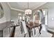 Dining room featuring hardwood floors, modern decor, and a view of the staircase at 2423 Rosapenna Nw Ln, Kennesaw, GA 30152