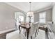 Elegant dining room with a chandelier and modern decor is perfect for entertaining guests at 2423 Rosapenna Nw Ln, Kennesaw, GA 30152