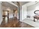 Open foyer with hardwood floors that lead to a living space and carpeted office at 2423 Rosapenna Nw Ln, Kennesaw, GA 30152