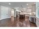 Spacious kitchen featuring stainless appliances, a central island, and hardwood flooring, perfect for cooking and entertaining at 2423 Rosapenna Nw Ln, Kennesaw, GA 30152