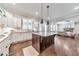 Bright kitchen features stainless appliances, a granite island, and opens to the living room, creating an inviting space at 2423 Rosapenna Nw Ln, Kennesaw, GA 30152