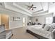 Large main bedroom showcasing a trey ceiling, sitting area, and ensuite bathroom at 2423 Rosapenna Nw Ln, Kennesaw, GA 30152