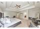 Large main bedroom showcasing a trey ceiling, sitting area, and ensuite bathroom at 2423 Rosapenna Nw Ln, Kennesaw, GA 30152