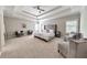 Large main bedroom with sitting area, trey ceiling, and neutral tones and large windows at 2423 Rosapenna Nw Ln, Kennesaw, GA 30152