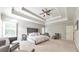 Spacious primary bedroom featuring a trey ceiling, carpet, and seating area at 2423 Rosapenna Nw Ln, Kennesaw, GA 30152