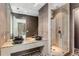 Modern bathroom featuring double vanities, granite countertops, and a glass-enclosed shower at 3184 Wood Valley Nw Rd, Atlanta, GA 30327