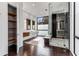 Modern bathroom with a walk-in shower, double vanity, open shelving, and large windows for natural light at 3184 Wood Valley Nw Rd, Atlanta, GA 30327