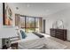 Bright bedroom with large windows and neutral decor, featuring a comfortable bed and wood furnishings at 3184 Wood Valley Nw Rd, Atlanta, GA 30327