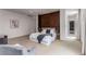Spacious bedroom features a luxurious bed, statement wall, and neutral color palette with an open ensuite bathroom at 3184 Wood Valley Nw Rd, Atlanta, GA 30327