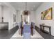 Spacious dining room with modern light fixture and long dining table at 3184 Wood Valley Nw Rd, Atlanta, GA 30327