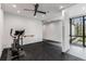 Bright exercise room with modern equipment, glass-walled room and views of the outdoors at 3184 Wood Valley Nw Rd, Atlanta, GA 30327