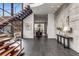 Inviting foyer showcases an open staircase, elegant lighting, and contemporary finishes, leading into the home at 3184 Wood Valley Nw Rd, Atlanta, GA 30327