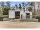 Stunning contemporary home featuring unique architecture and professional landscaping for sophisticated curb appeal at 3184 Wood Valley Nw Rd, Atlanta, GA 30327