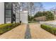 Contemporary residence featuring an expansive lawn and well-maintained landscaping, enhancing its natural beauty at 3184 Wood Valley Nw Rd, Atlanta, GA 30327
