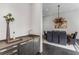 Bar area near a dining room with seating for eight under a modern light at 3184 Wood Valley Nw Rd, Atlanta, GA 30327