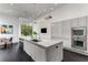 Kitchen featuring a large island, stainless steel appliances, and sleek cabinets at 3184 Wood Valley Nw Rd, Atlanta, GA 30327