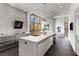 Modern kitchen featuring a large island, stainless steel appliances, and floor to ceiling windows at 3184 Wood Valley Nw Rd, Atlanta, GA 30327
